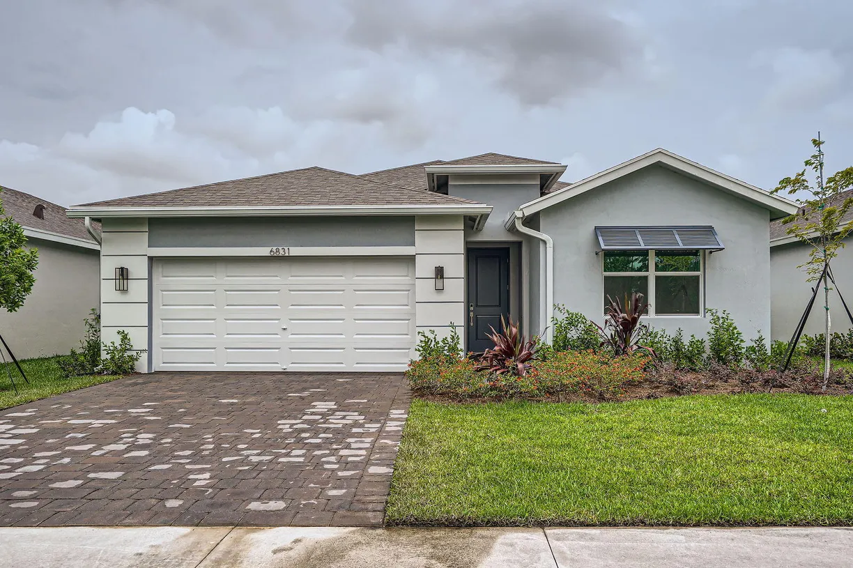 South Florida Real Estate | View 6831 SE Park Trace Drive | 4 Beds, 2 Baths