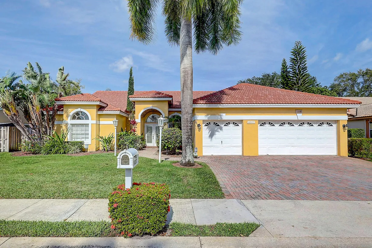 South Florida Real Estate | View 10207 Allamanda Boulevard | 4 Beds, 3 Baths