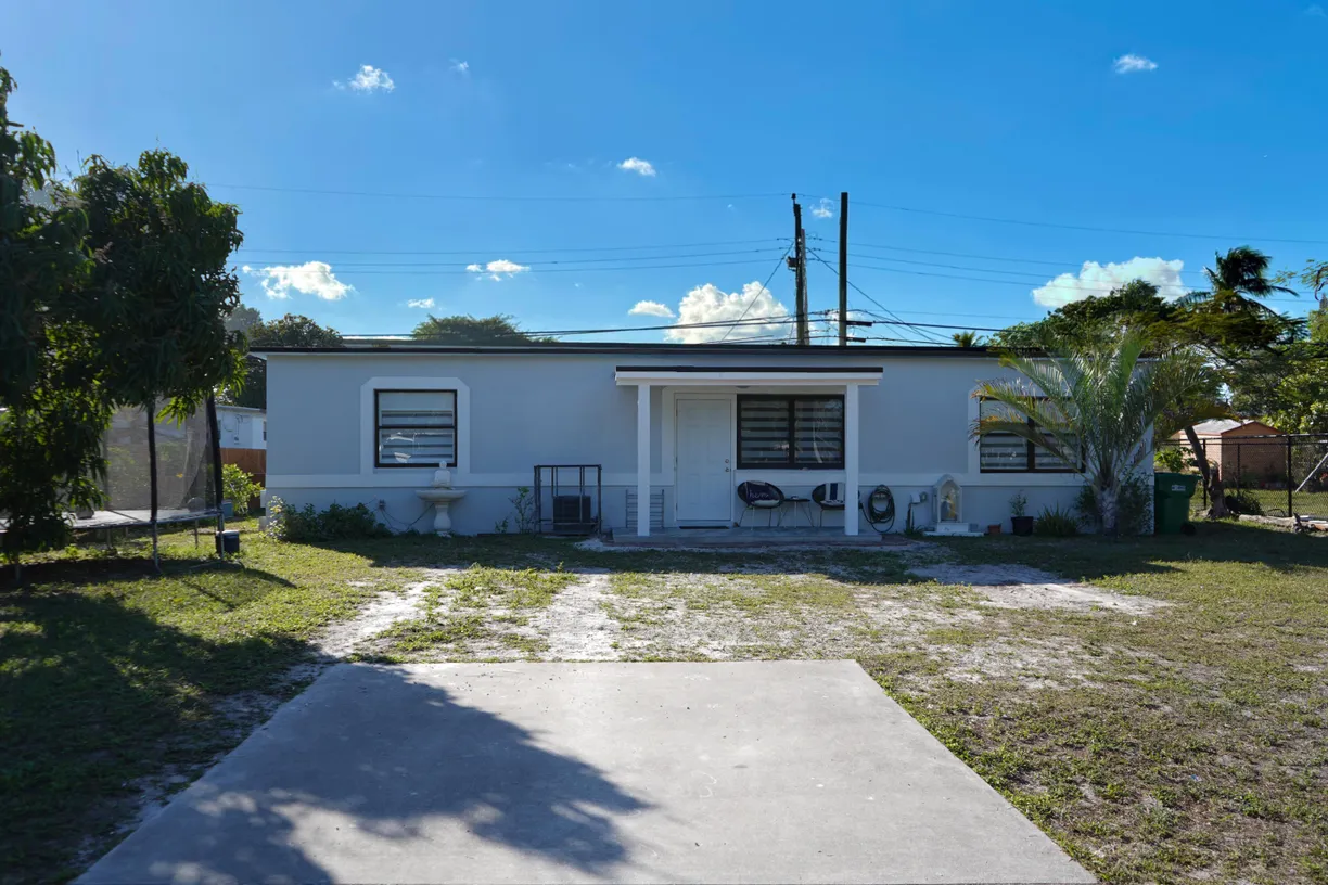 South Florida Real Estate | View 303 NW 28 Way | 3 Beds, 2 Baths
