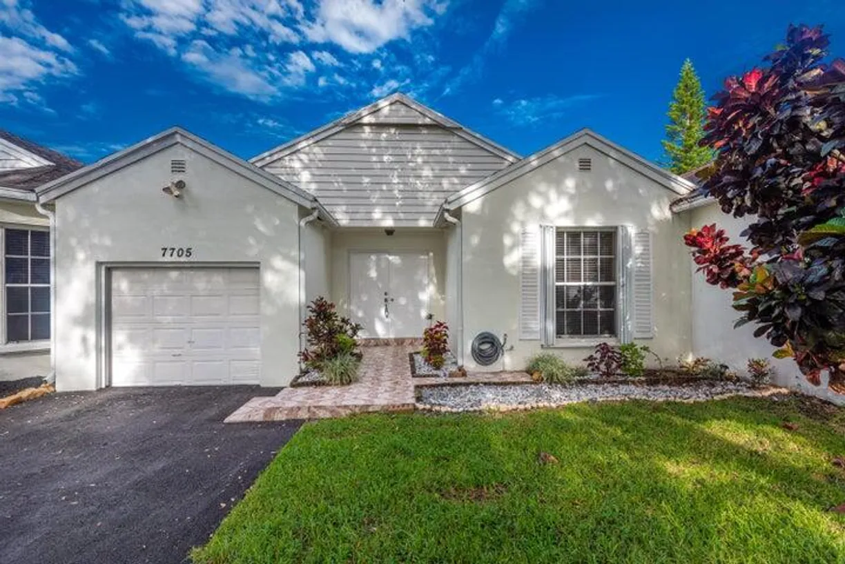South Florida Real Estate | View 7705 Forest Green Lane | 3 Beds, 2 Baths