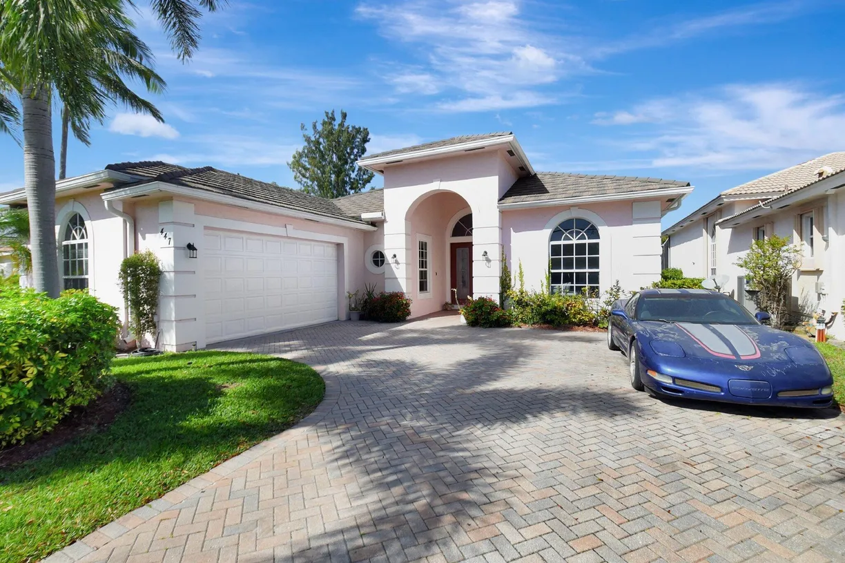 South Florida Real Estate | View 447 Pine Tree Court | 4 Beds, 3 Baths