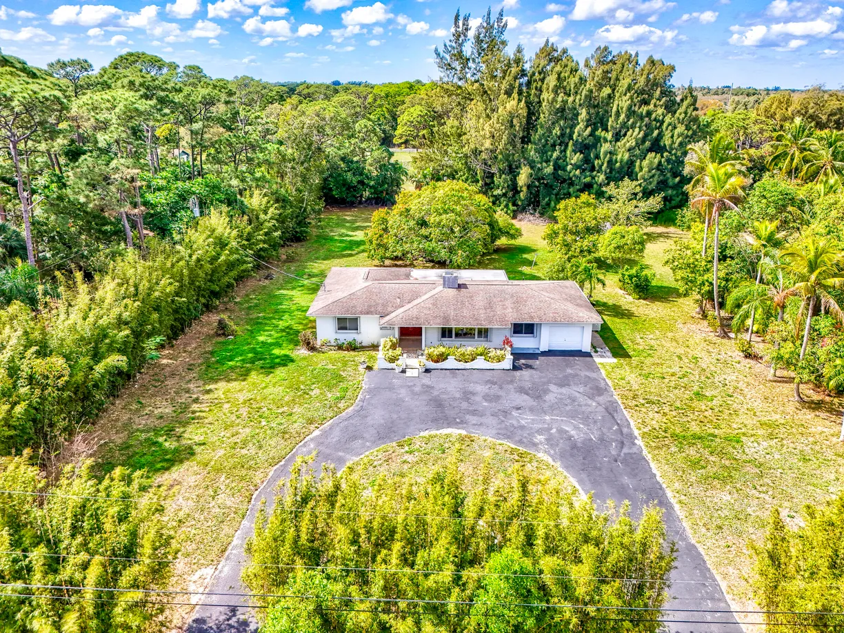 South Florida Real Estate | View 8902 N Bates Road | 4 Beds, 3 Baths