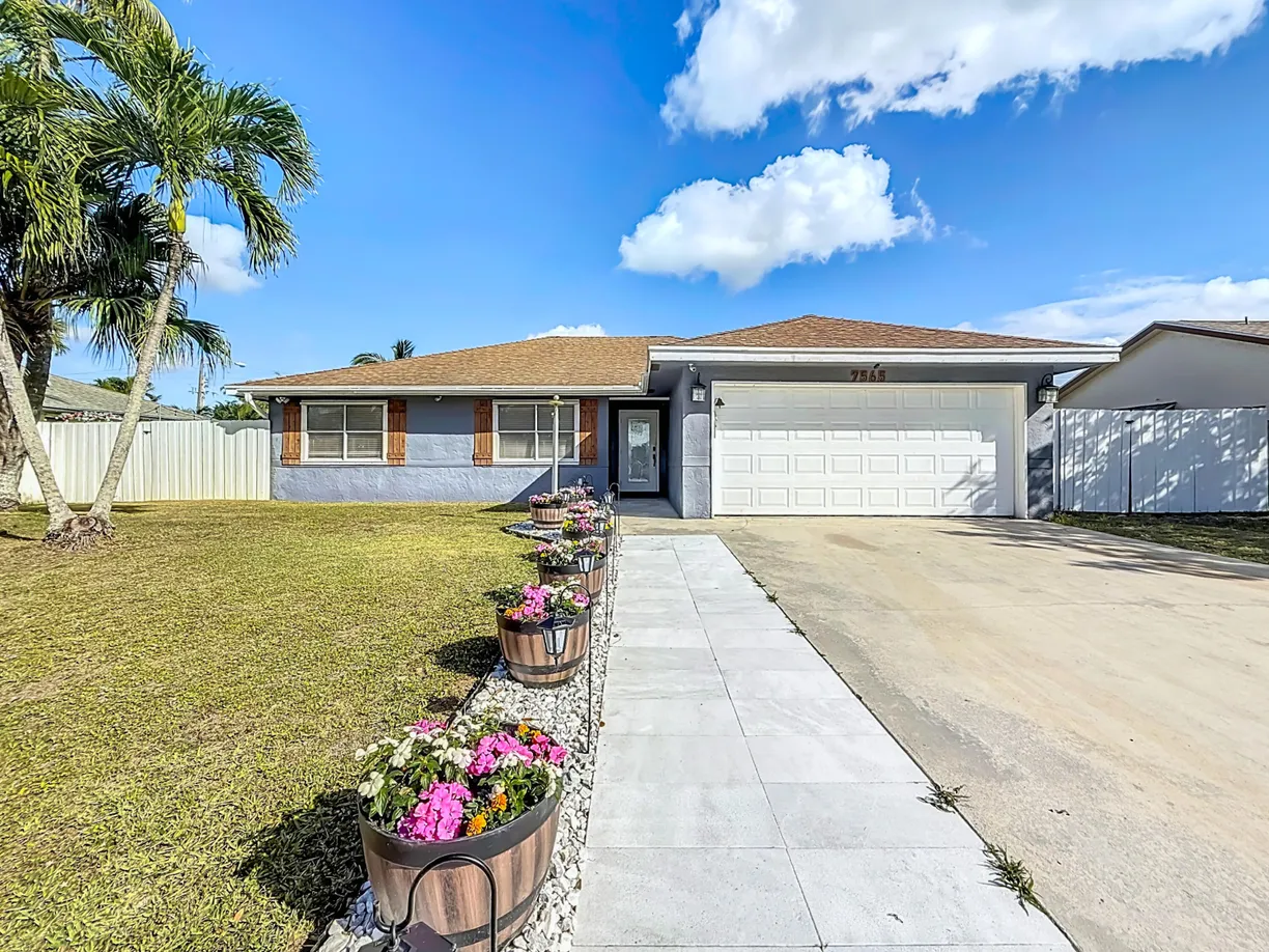 South Florida Real Estate | View 7565 Woodland Creek Lane | 3 Beds, 2 Baths