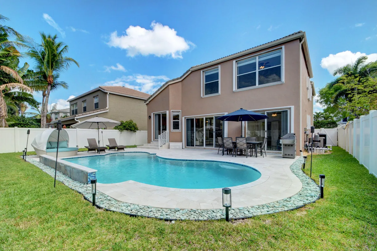 South Florida Real Estate | View 2418 Westmont Drive | 4 Beds, 3 Baths