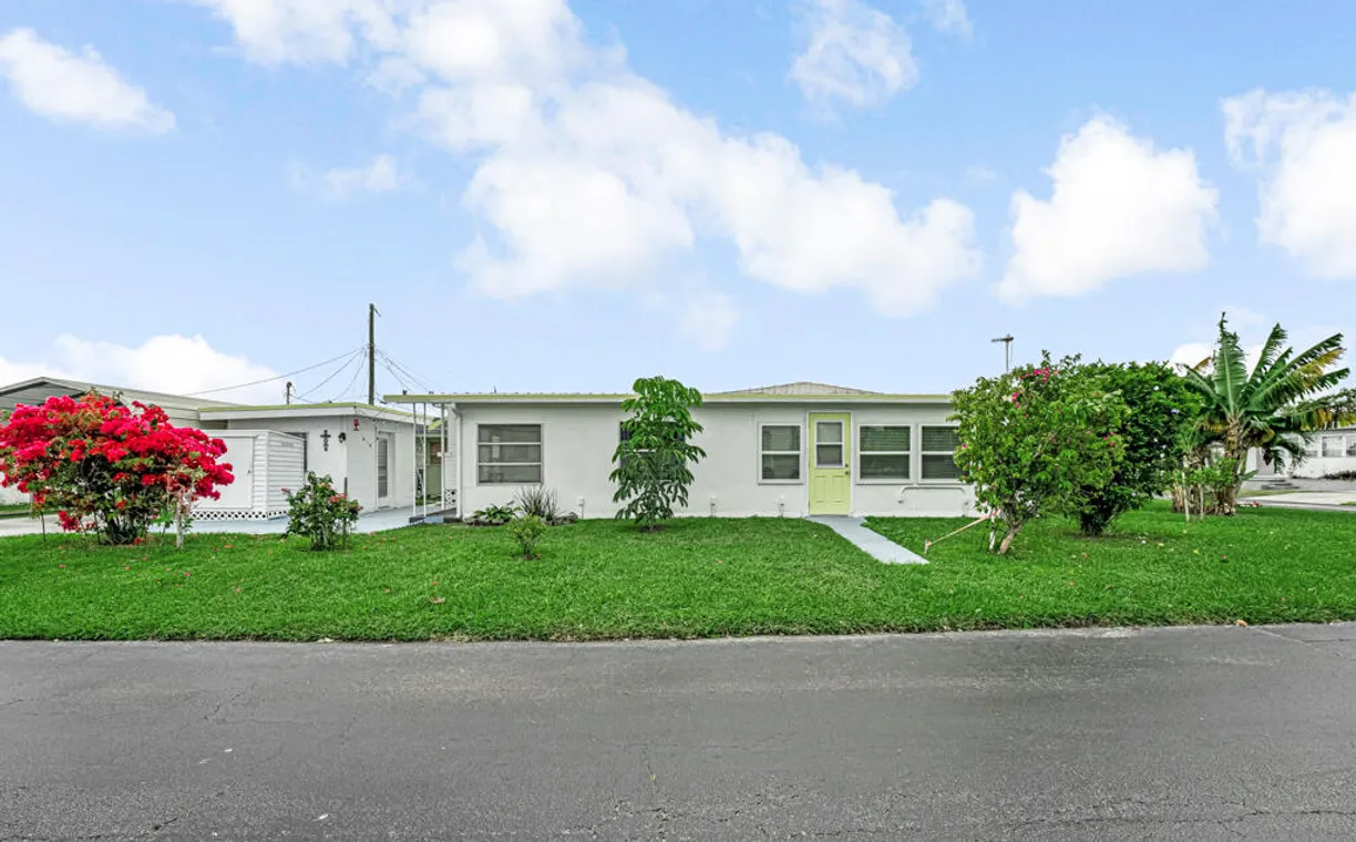 South Florida Real Estate | View 8904 Palm St. Street | 2 Beds, 2 Baths