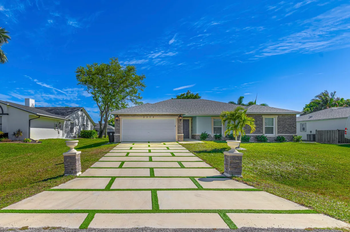 South Florida Real Estate | View 2372 SE Maslan Avenue | 4 Beds, 2 Baths