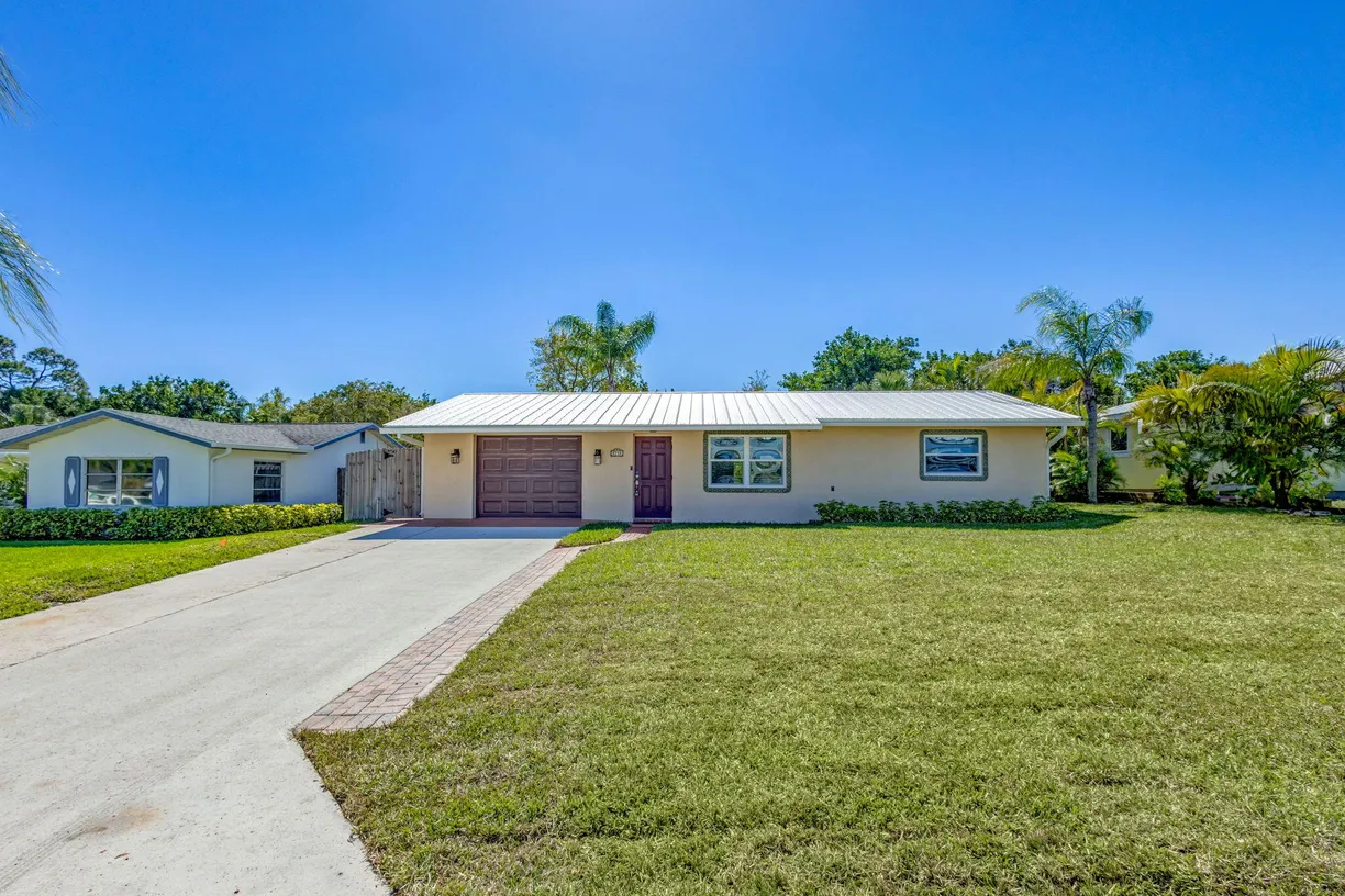 South Florida Real Estate | View 8714 SE Jardin Street | 2 Beds, 2 Baths