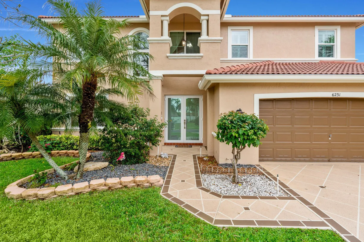 South Florida Real Estate | View 6231 Shadow Tree Lane | 4 Beds, 3 Baths