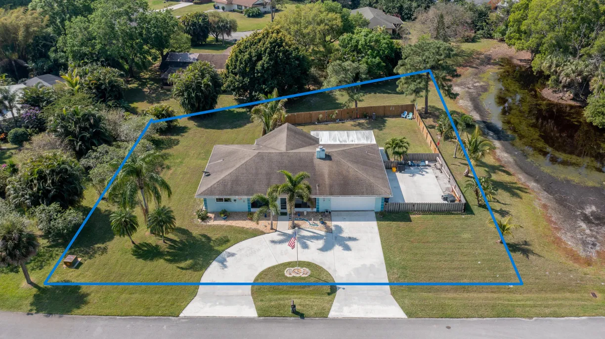 South Florida Real Estate | View 5580 SE Paramount Drive | 3 Beds, 2 Baths