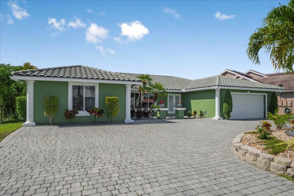South Florida Real Estate | View 11408 NW 20th Drive | 4 Beds, 2 Baths