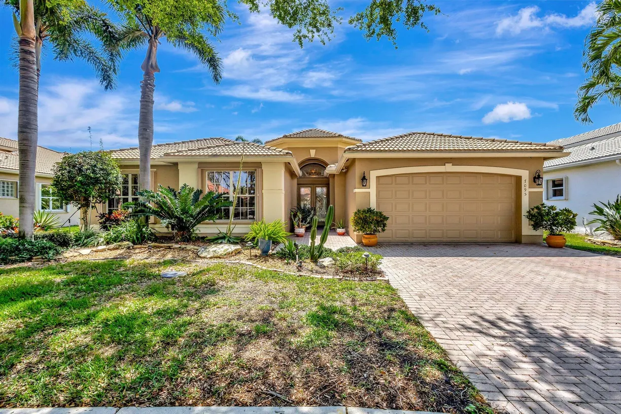 South Florida Real Estate | View 7095 Corning Circle | 4 Beds, 2 Baths