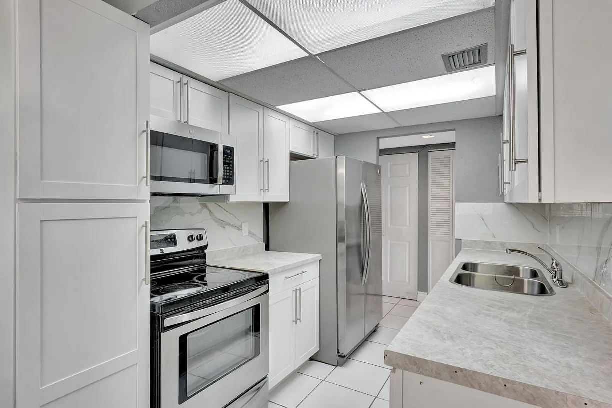 South Florida Real Estate | View 6190 Woodlands Boulevard, 311 | Listing