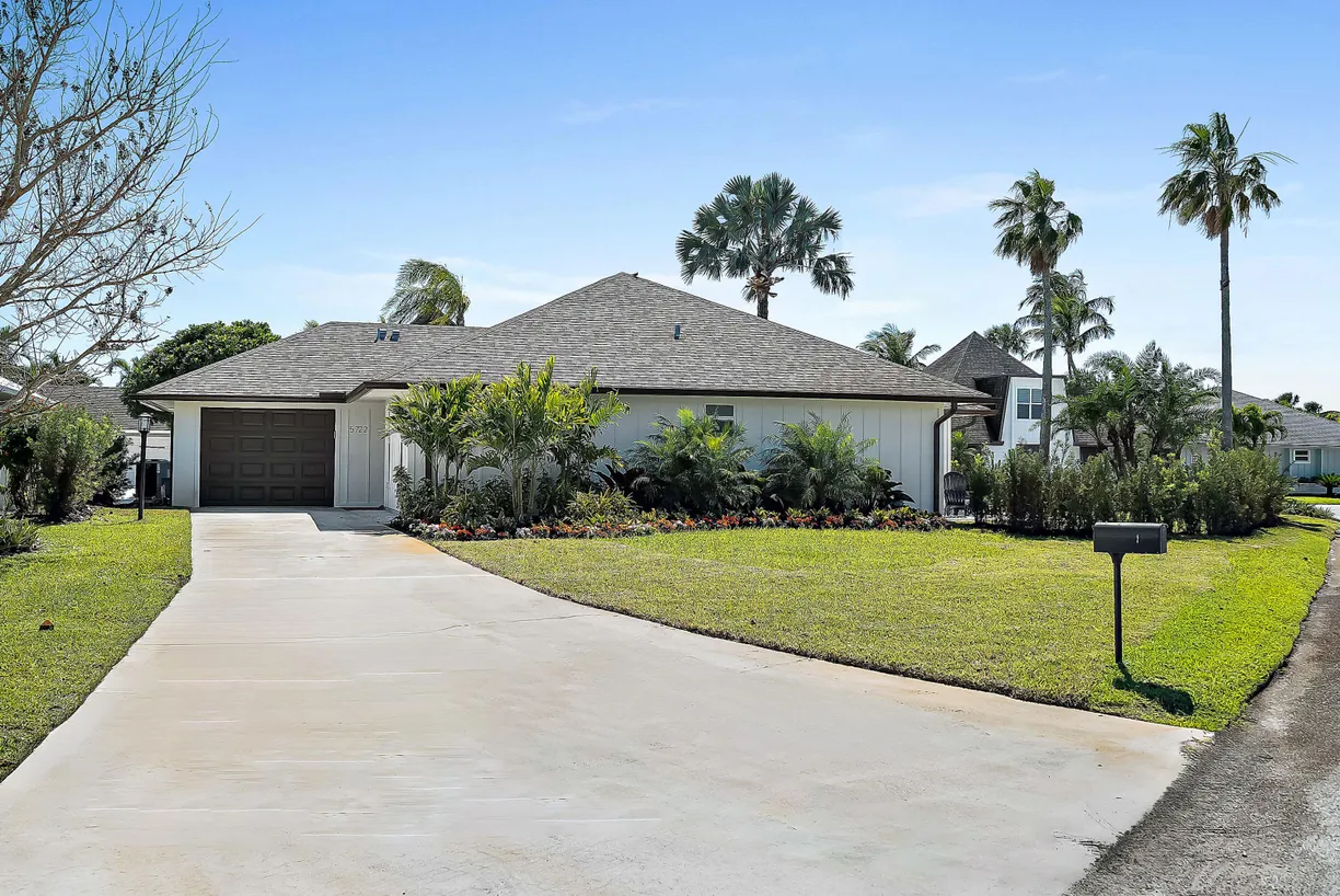 South Florida Real Estate | View 5722 SE Miles Grant Road | 3 Beds, 2 Baths