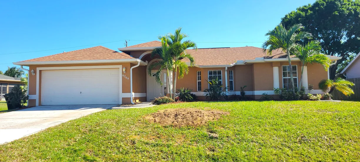 South Florida Real Estate | View 6769 NW Abigail Avenue | 3 Beds, 2 Baths