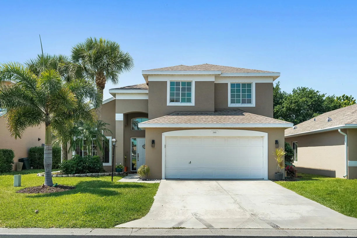 South Florida Real Estate | View 2480 SE Springtree Place | 4 Beds, 2 Baths