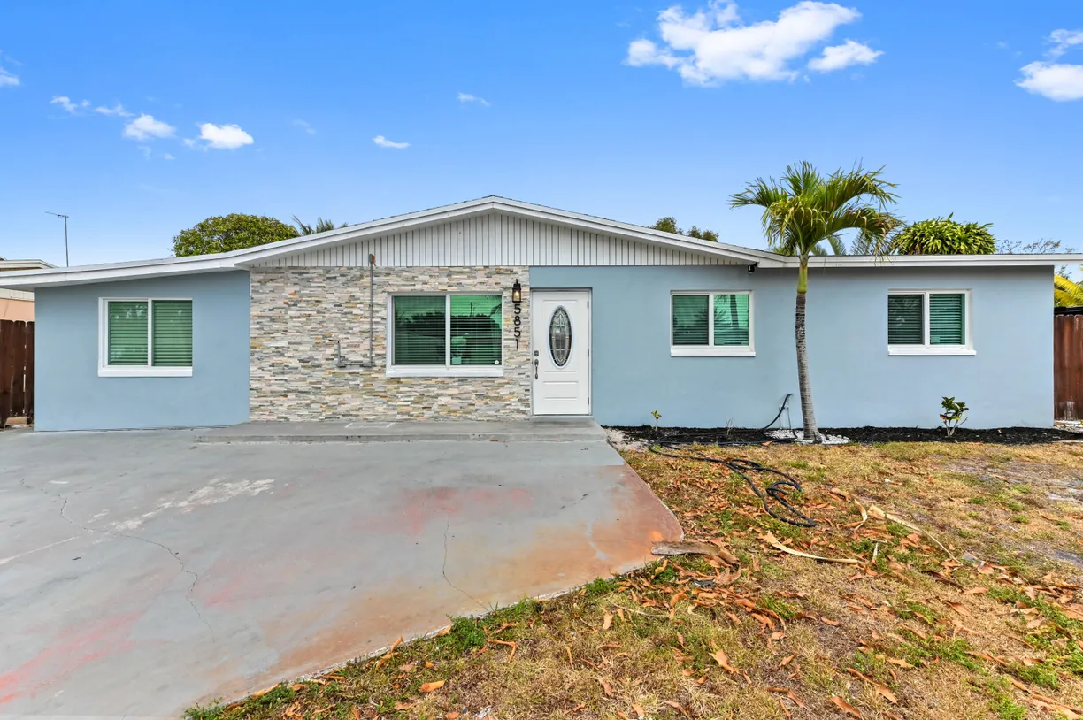 South Florida Real Estate | View 5851 Daphne Drive | 4 Beds, 2 Baths
