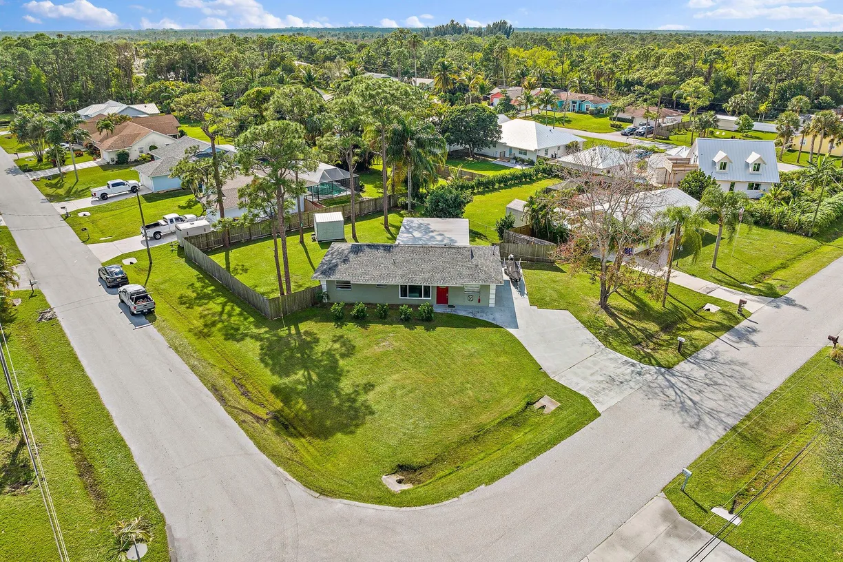 South Florida Real Estate | View 5854 SE Orange Blossom Trail | 4 Beds, 3 Baths