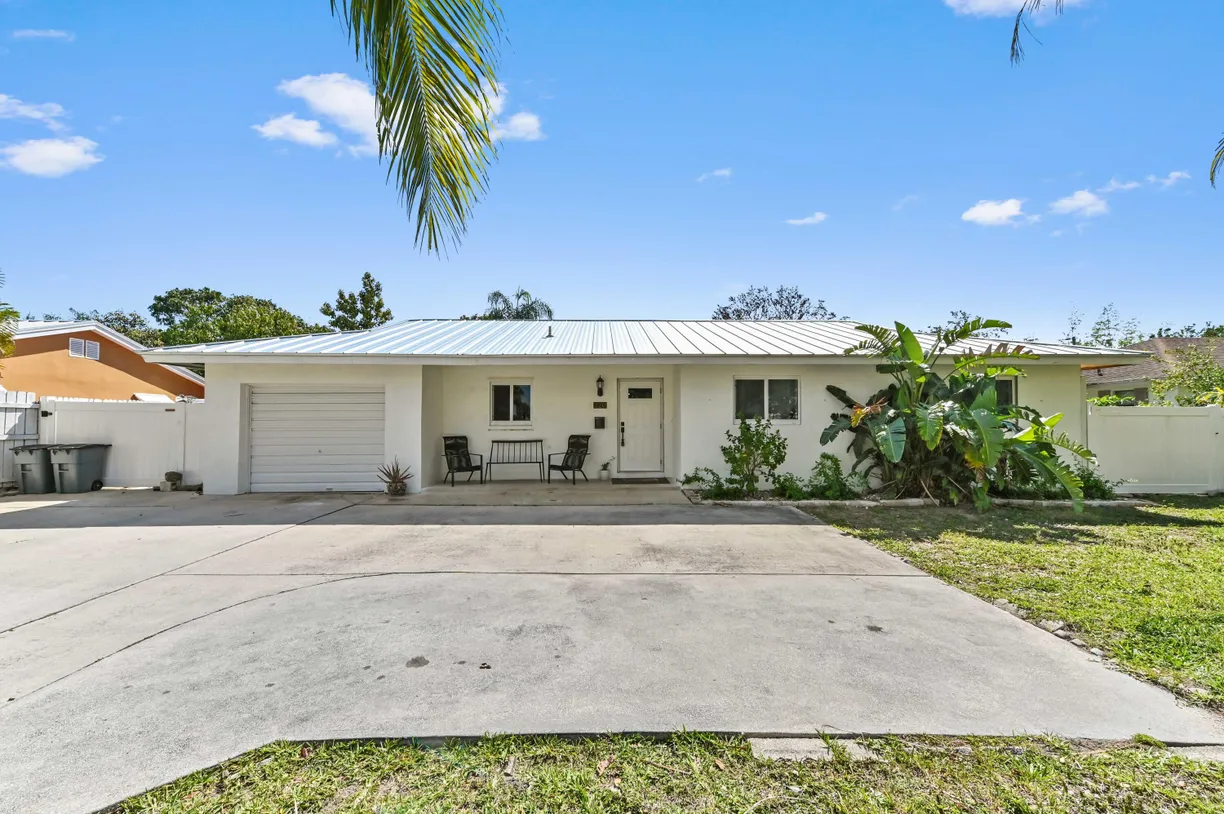 South Florida Real Estate | View 720 Prosperity Farms Road | 3 Beds, 2 Baths