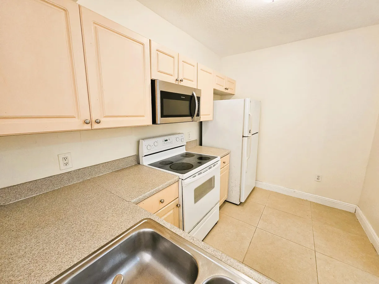 South Florida Real Estate | View 1055 Golden Lakes Boulevard, 213 | Listing