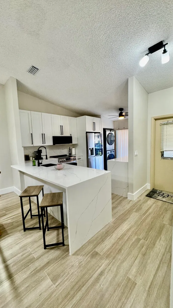 South Florida Real Estate | View 705 Sunny Pine Way, Apt E | Listing