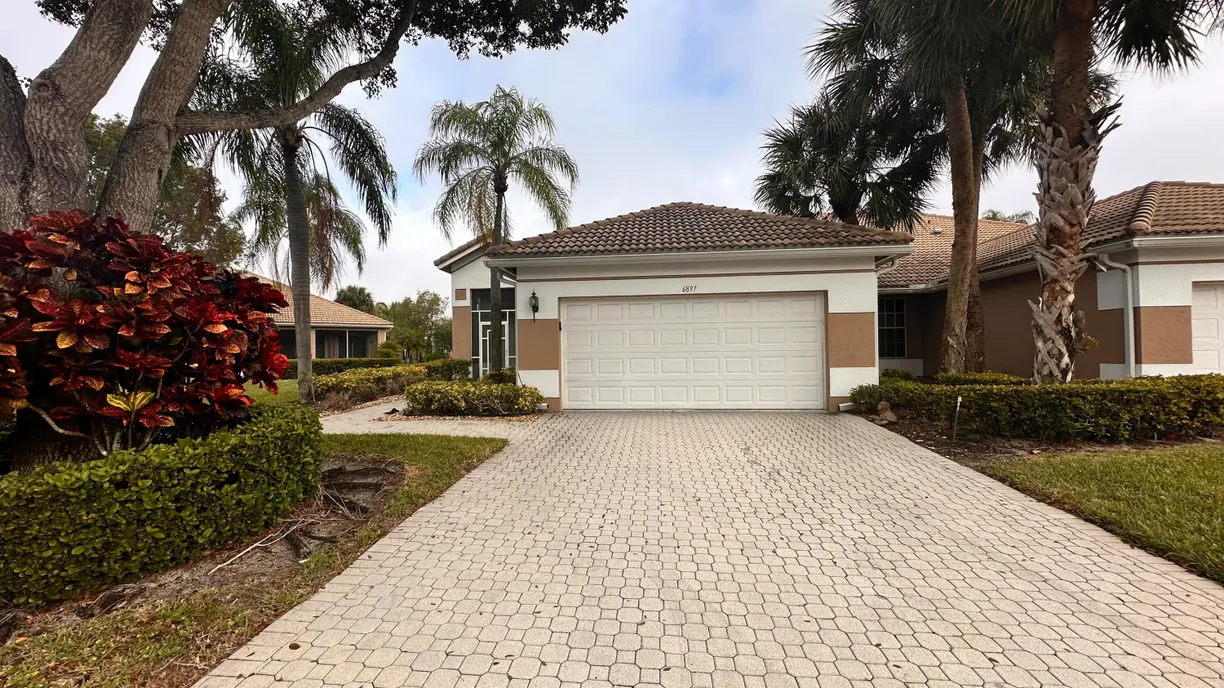 South Florida Real Estate | View 6897 Swan Sea Lane | 3 Beds, 2 Baths