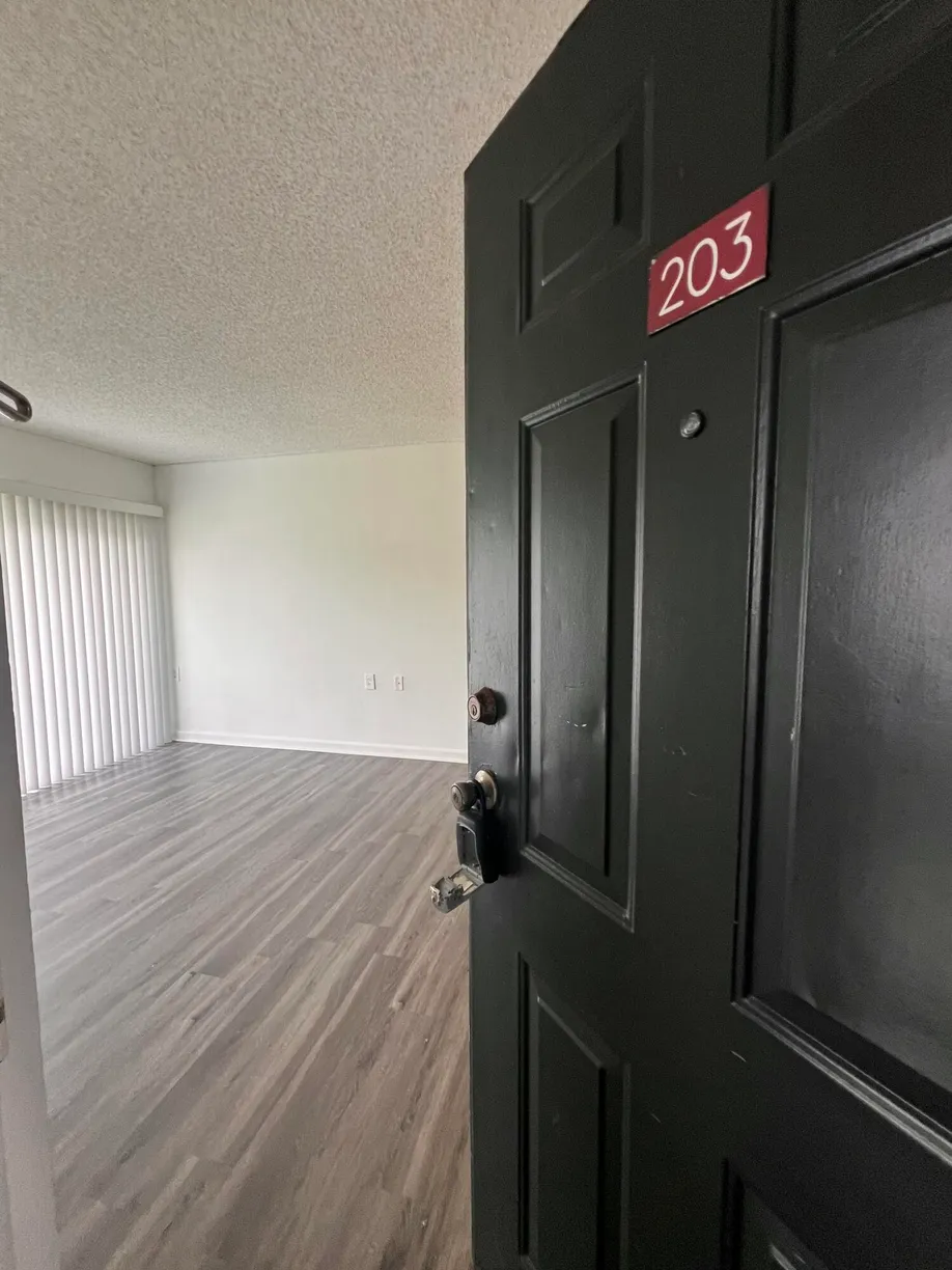 South Florida Real Estate | View 1215 N Benoist Farms Road, 203 | 2 Beds, 1 Bath