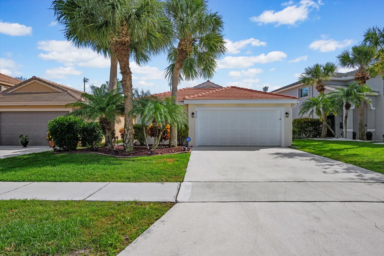 South Florida Real Estate | View 6116 Spring Isles Boulevard | 3 Beds, 2 Baths