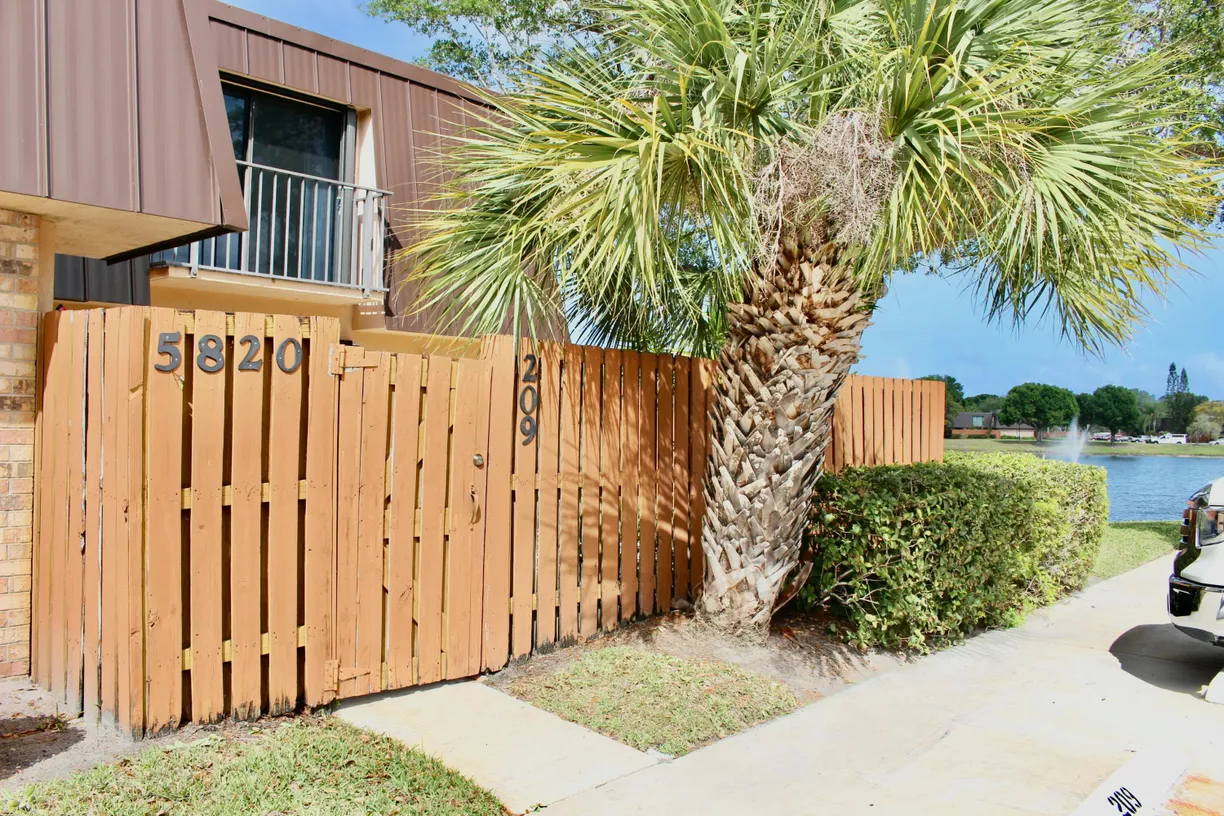 South Florida Real Estate | View 5820 SE Windsong Lane | 2 Beds, 2 Baths