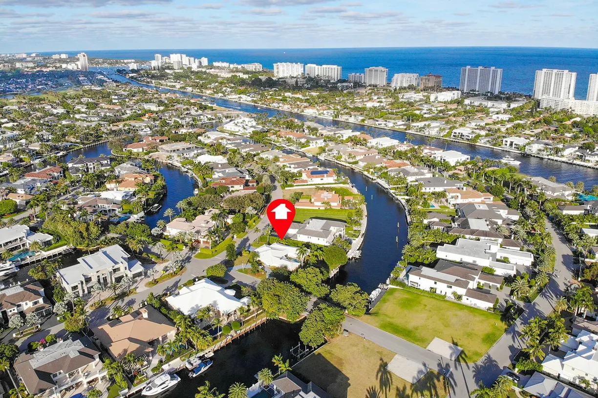 South Florida Real Estate | View 300 E Coconut Palm Road | 4 Beds, 4 Baths