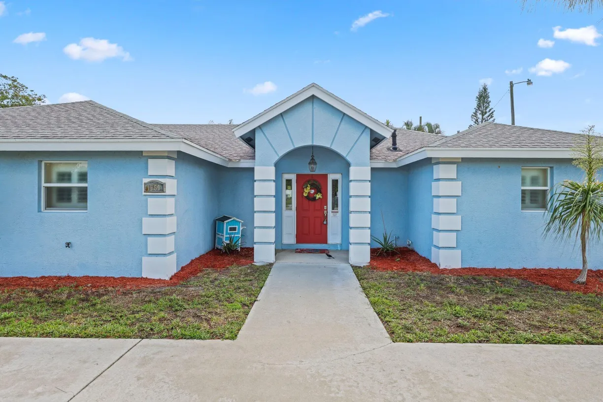 South Florida Real Estate | View 1750 E Breezy Lane | 4 Beds, 4 Baths