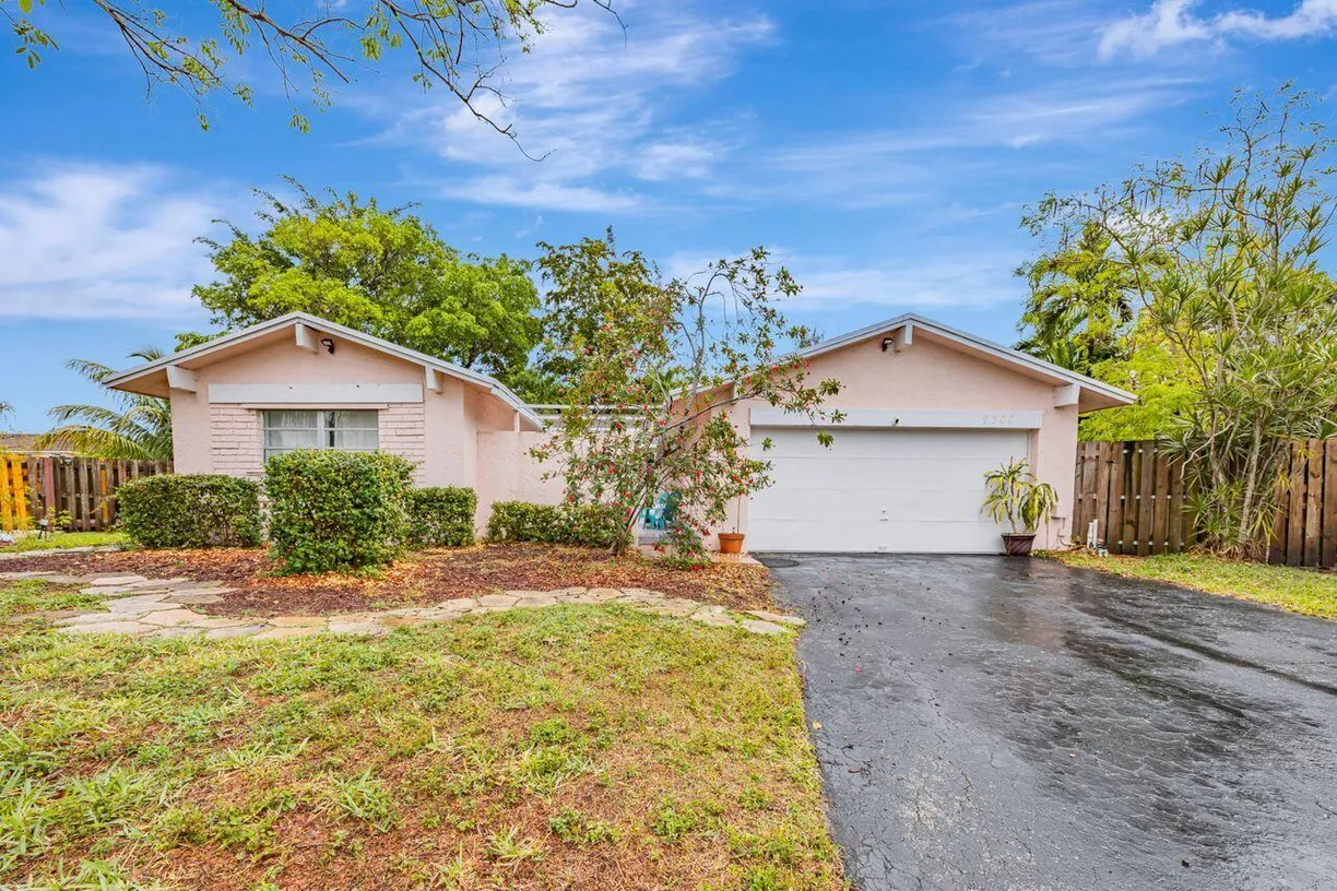 South Florida Real Estate | View 9300 NW 38 Place | 5 Beds, 2 Baths