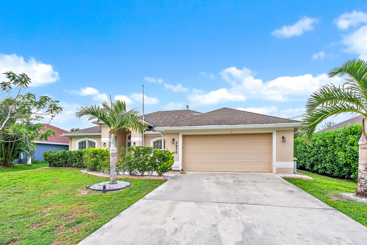 South Florida Real Estate | View 1433 SW Edinburgh Drive | 4 Beds, 2 Baths