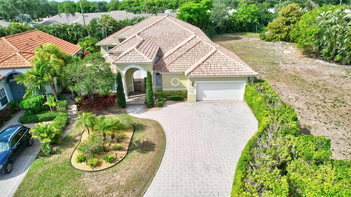 South Florida Real Estate | View 9152 Long Lake Palm Drive | 4 Beds, 4 Baths