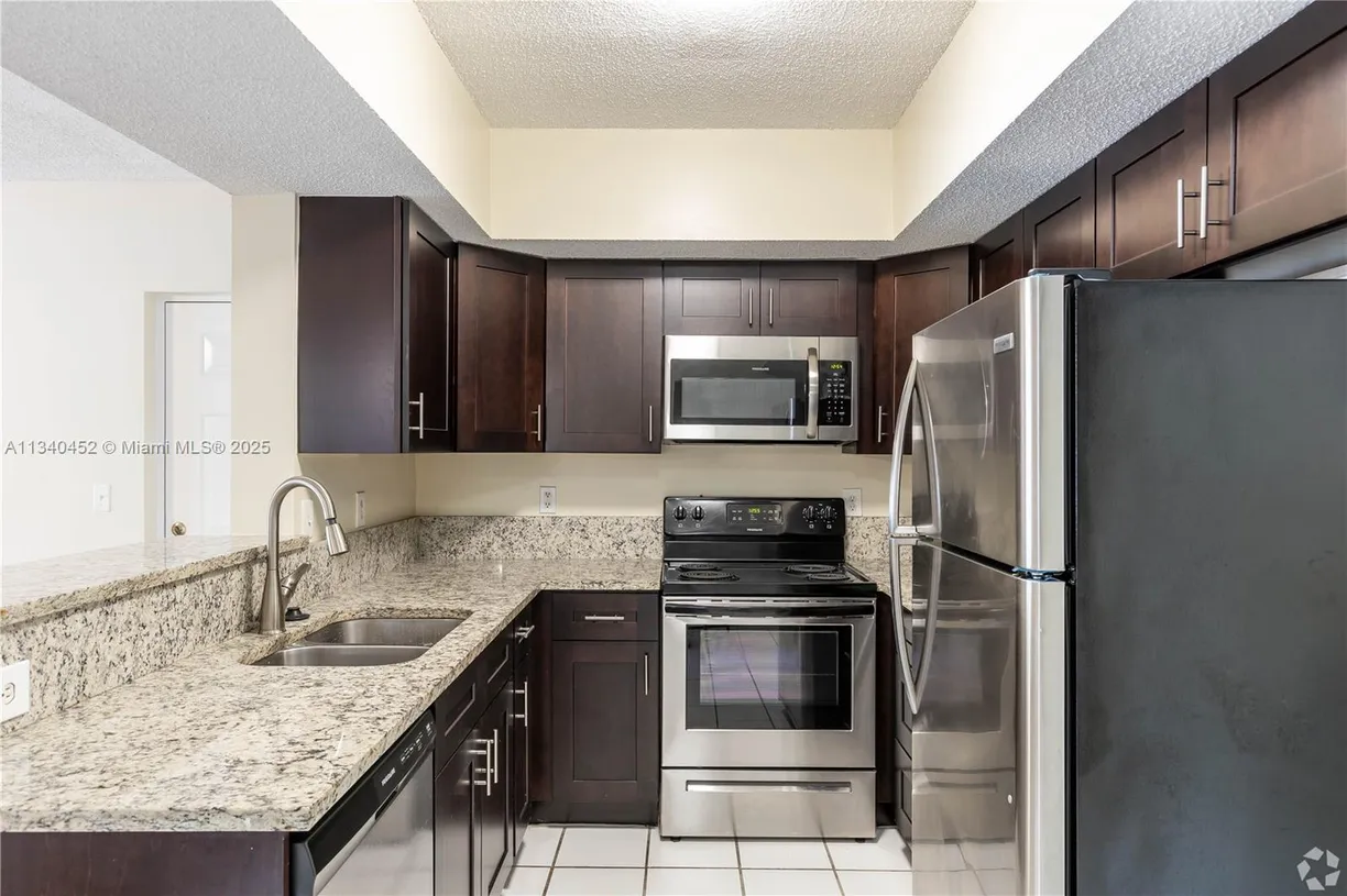 South Florida Real Estate | View 5520 NW 61st St, 211 | Listing