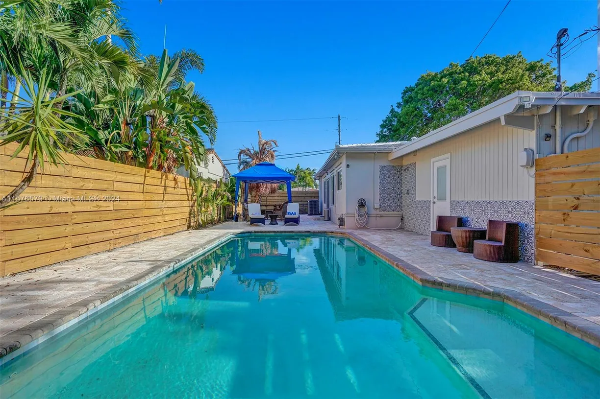 South Florida Real Estate | View 1800 N Victoria Park Rd | 4 Beds, 3 Baths