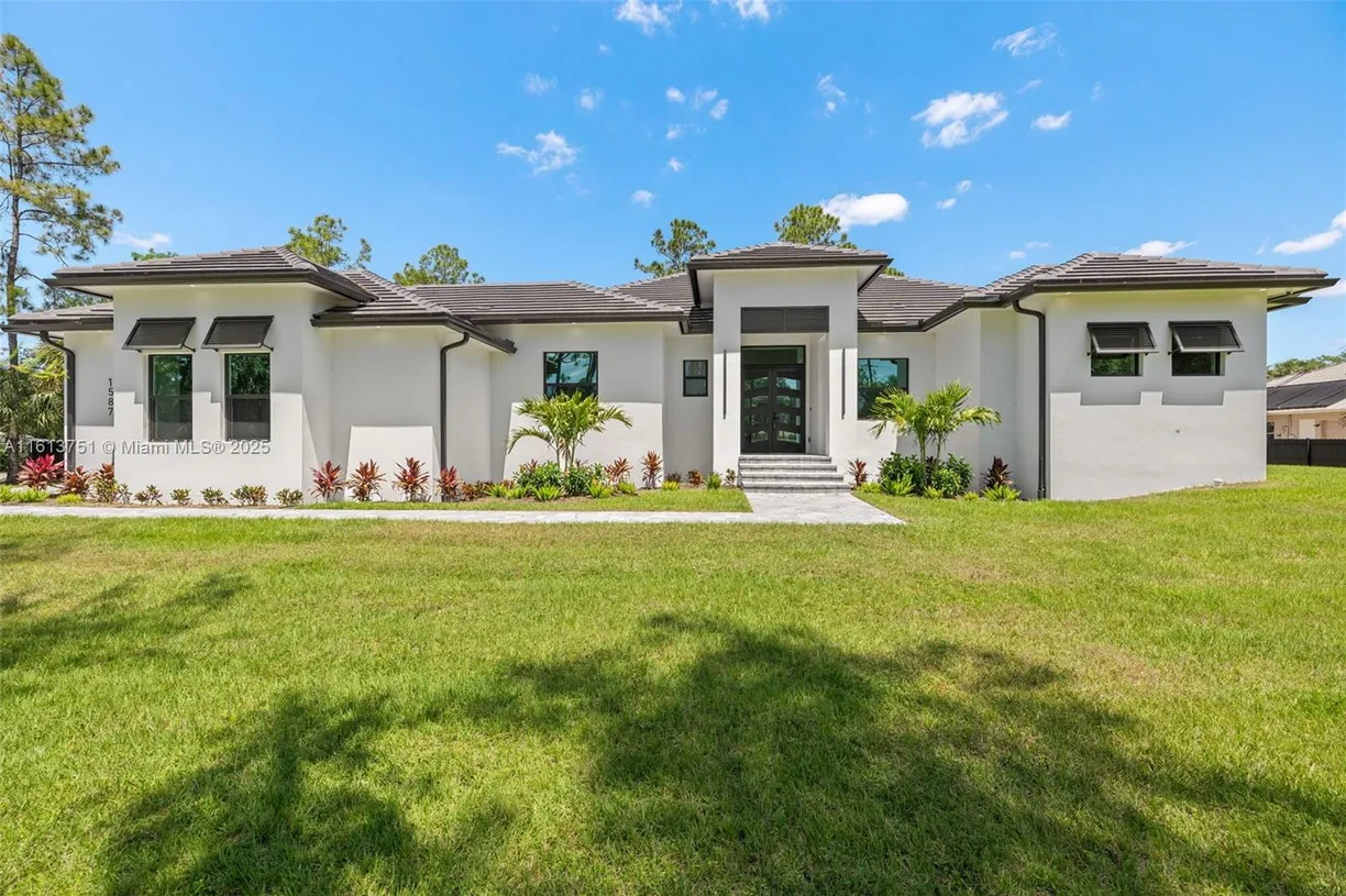 South Florida Real Estate | View 1587 W GOLDEN GATE BLVD | 4 Beds, 3 Baths