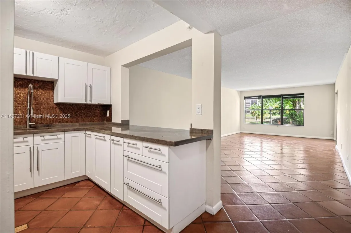 South Florida Real Estate | View 2305 S Cypress Bend Dr, 104D | Listing