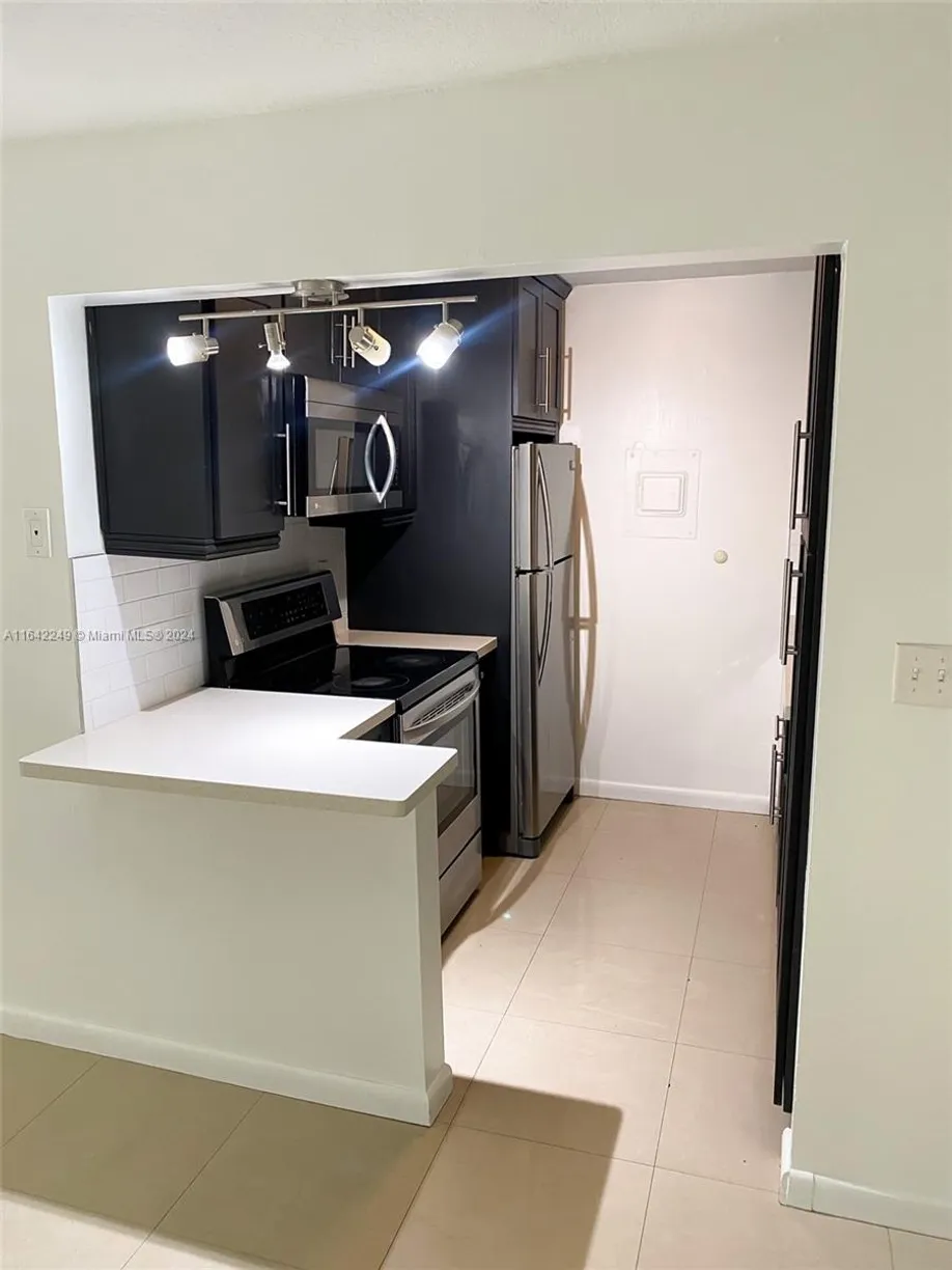 South Florida Real Estate | View 633 S Royal Poinciana Blvd, A106 | 1 Bed, 1 Bath