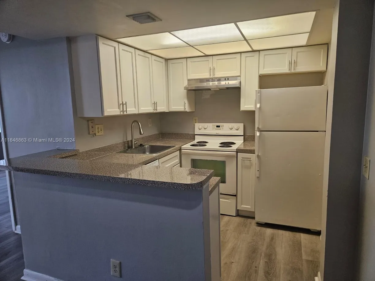South Florida Real Estate | View 734 Executive Center Dr, 32 | Listing