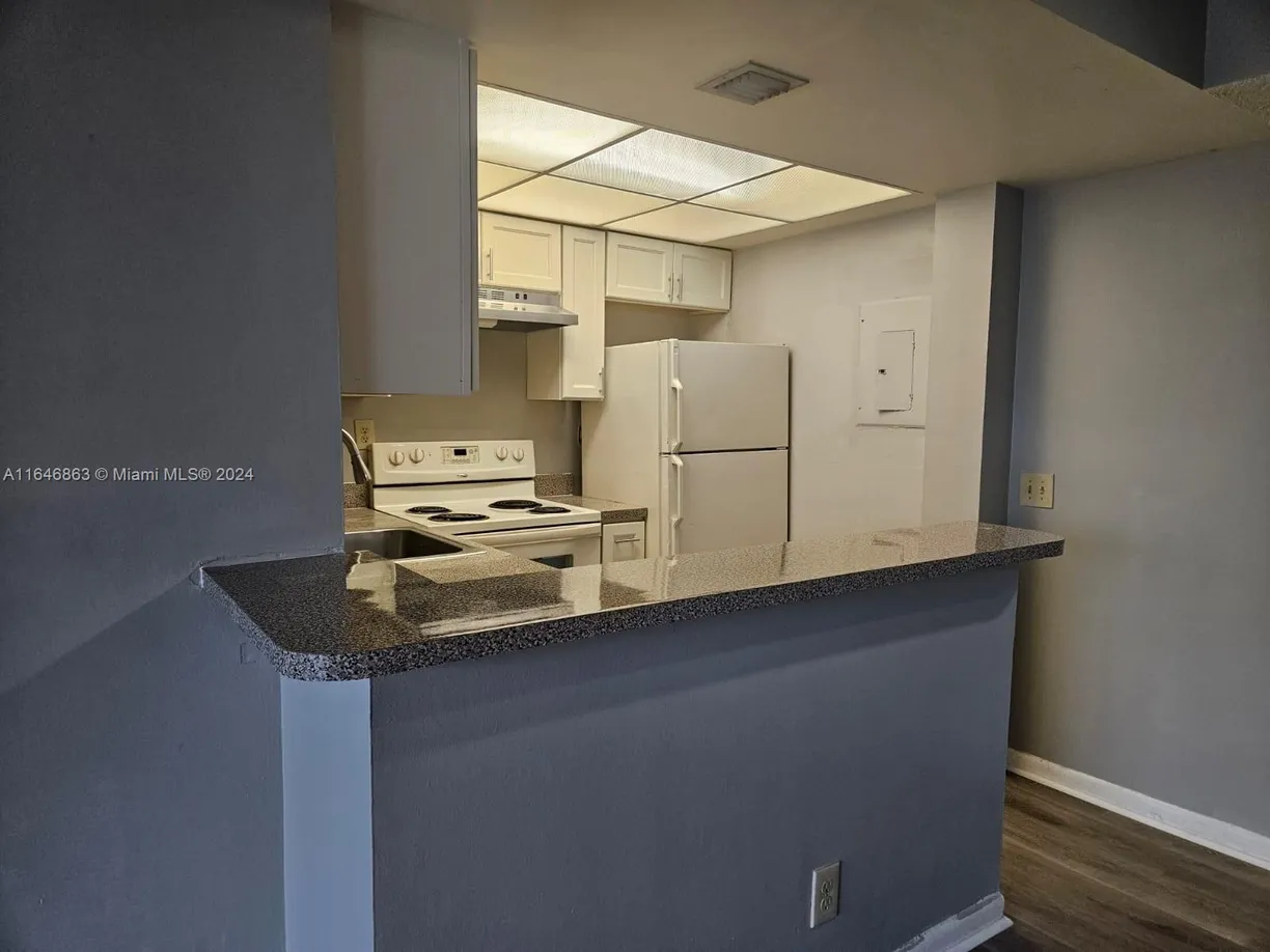 South Florida Real Estate | View 734 Executive Center Dr, 32 | Listing