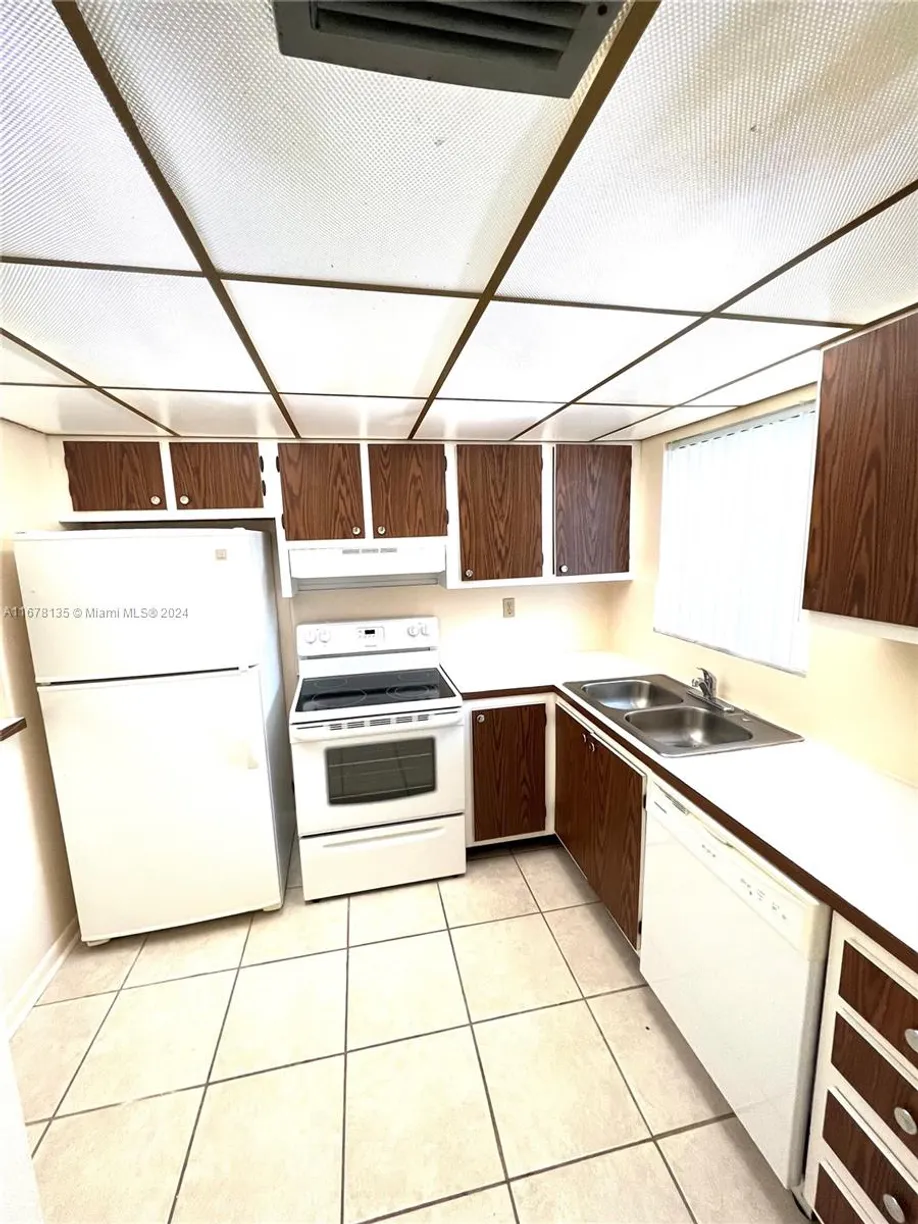South Florida Real Estate | View 6570 Royal Palm Blvd, 107J | Listing