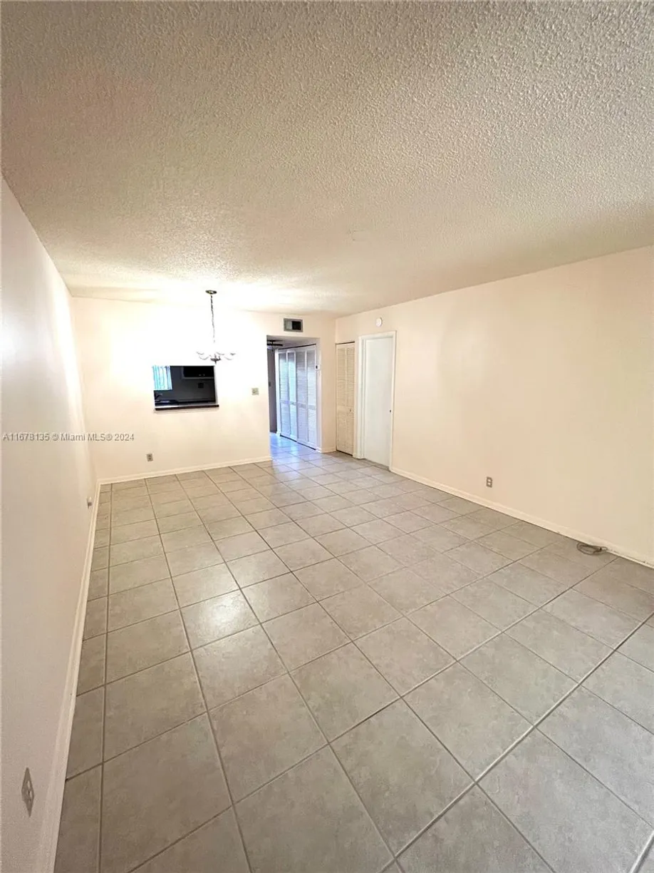 South Florida Real Estate | View 6570 Royal Palm Blvd, 107J | 1 Bed, 1 Bath