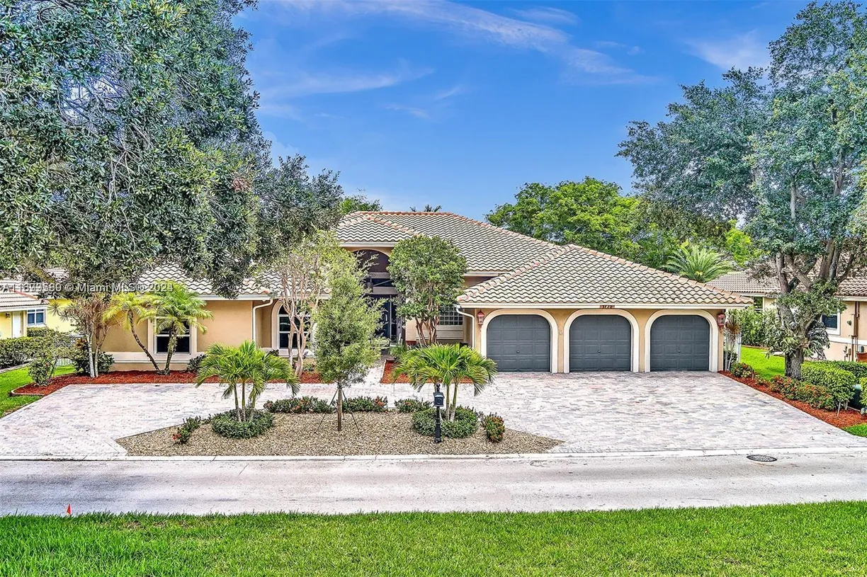 South Florida Real Estate | View 1775 W Eagle Trace Blvd W | 4 Beds, 4 Baths