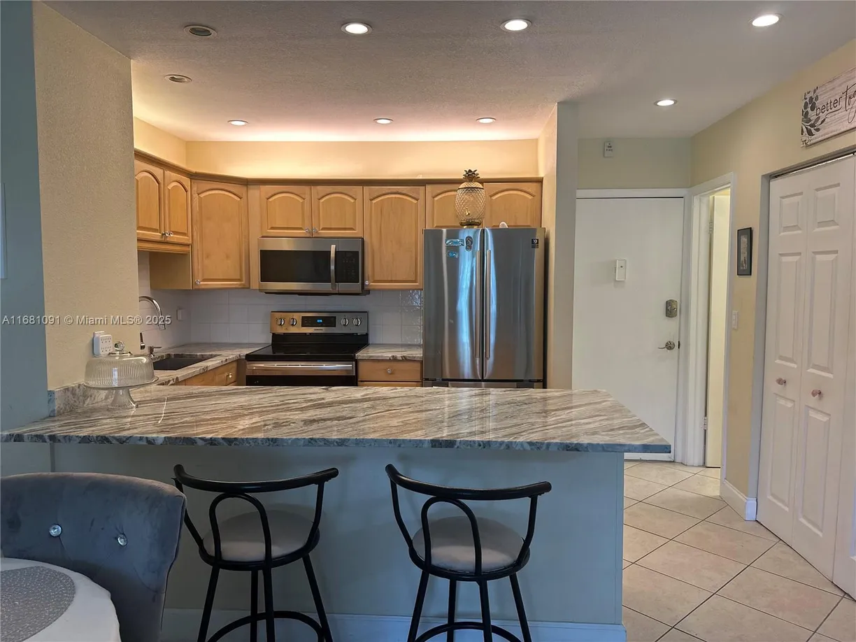 South Florida Real Estate | View 1520 Mckinley St, 103E | 1 Bed, 1 Bath