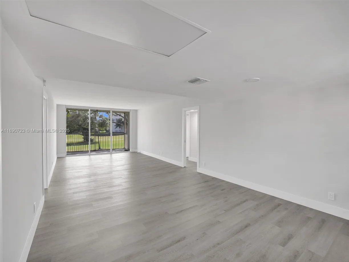 South Florida Real Estate | View 3700 Oaks Clubhouse Dr, 203 | Listing