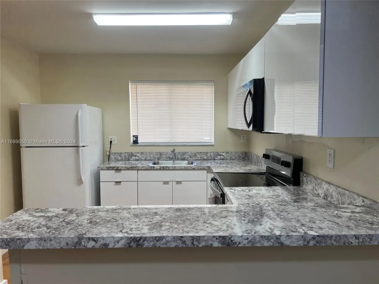 South Florida Real Estate | View 14901 SW 80th St, 102 | 2 Beds, 2 Baths