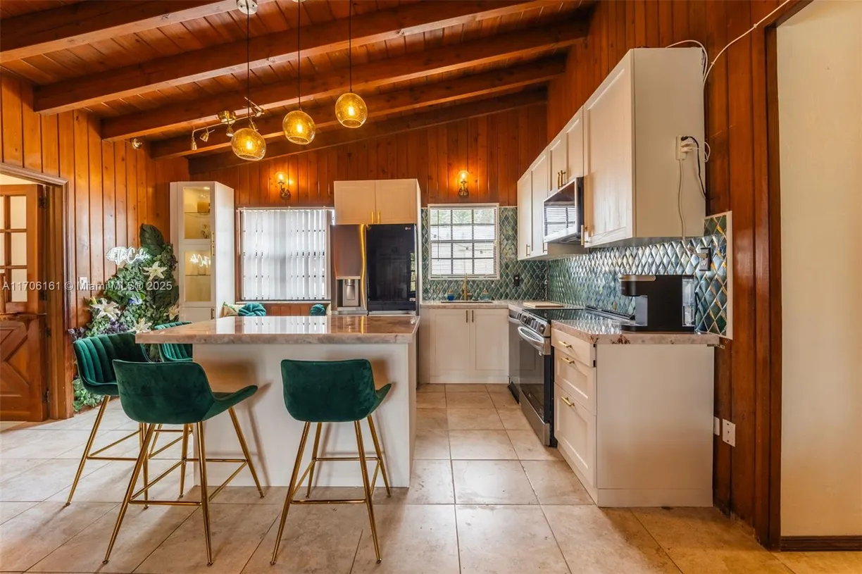 South Florida Real Estate | View 301 SW 69th Ave | 4 Beds, 2 Baths