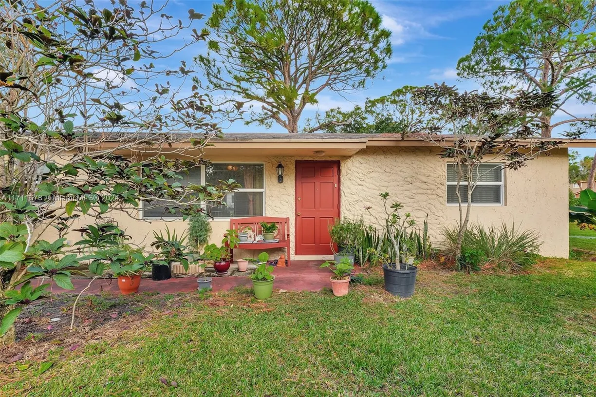 South Florida Real Estate | View 412 SW Natura Ave | 3 Beds, 2 Baths