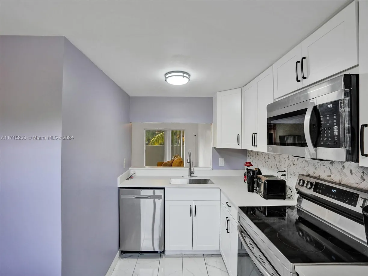 South Florida Real Estate | View 6075 N Sabal Palm Blvd, 212 | Listing