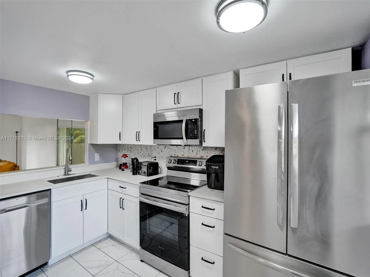 South Florida Real Estate | View 6075 N Sabal Palm Blvd, 212 | 2 Beds, 2 Baths